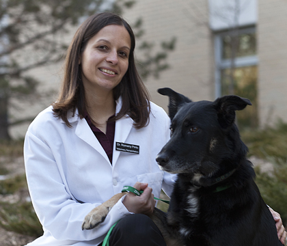 Dr. Romany Pinto and Rosie, one of her canine patients. Photo: Christina Weese.